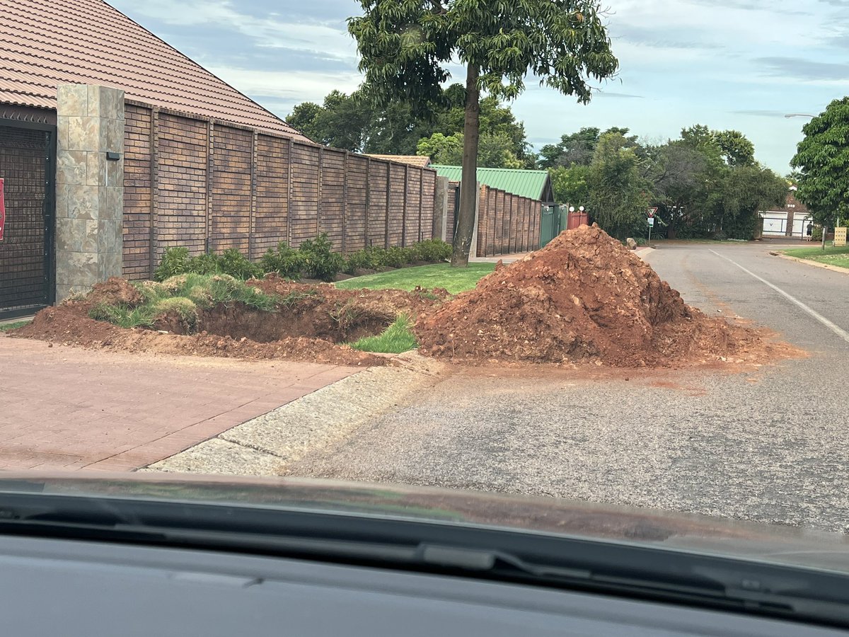 lizylab's tweet photo. @CityTshwane Nearly wrote off my rental car when I drove to my parents house last night and found this heap of ground obstructing my route. A water pipe burst on 8 Jan and the job is still not completed! No red/white tape to warn the public!! https://t.co/0NWMm5llT6
