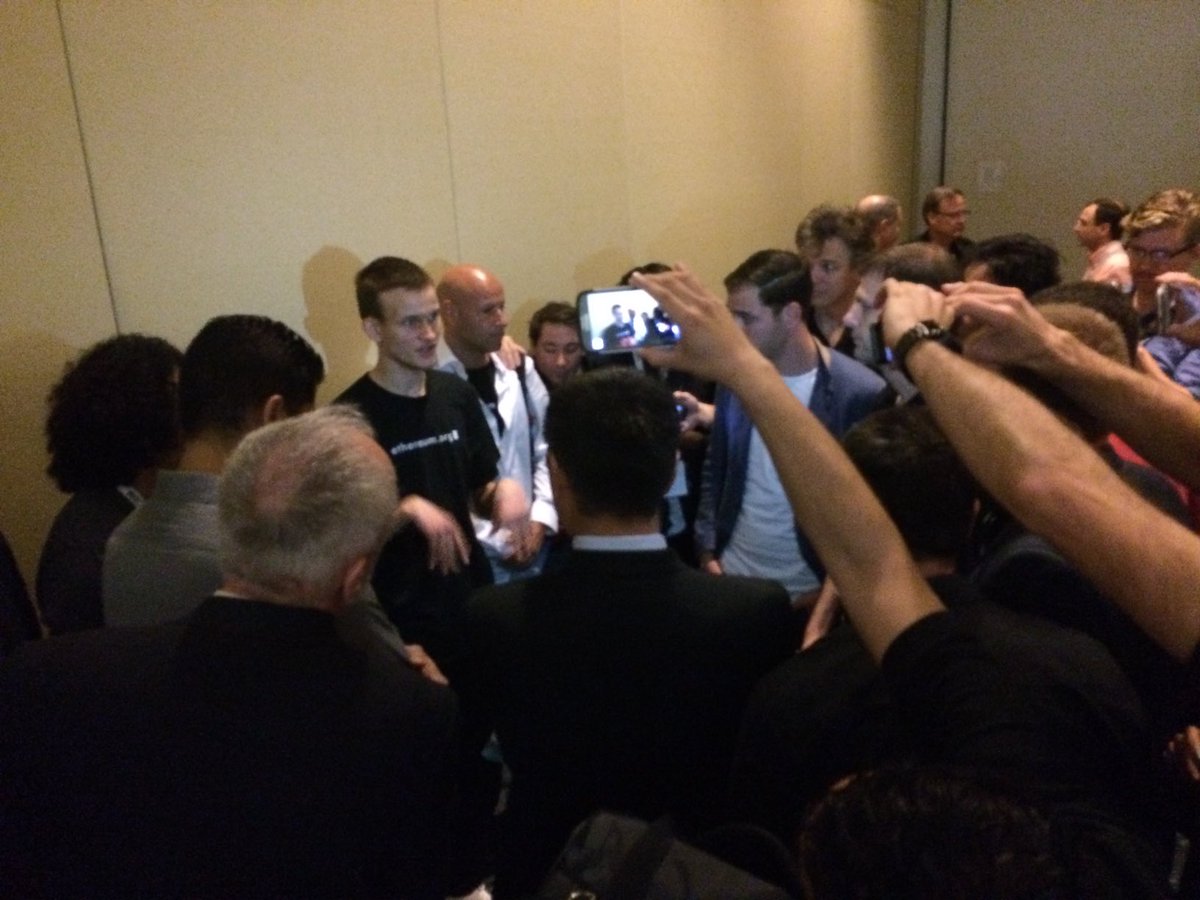 TaylorGerring's tweet photo. 8 years ago today, #Ethereum was formally announced in Miami. After a standing-room only talk and extended line of questions, we all shuffled into a hallway to make room for the next speaker. Joe Lubin and Anthony Di’Iorio can be seen next to Vitalik as the crowd encroaches https://t.co/syDlKe5coF