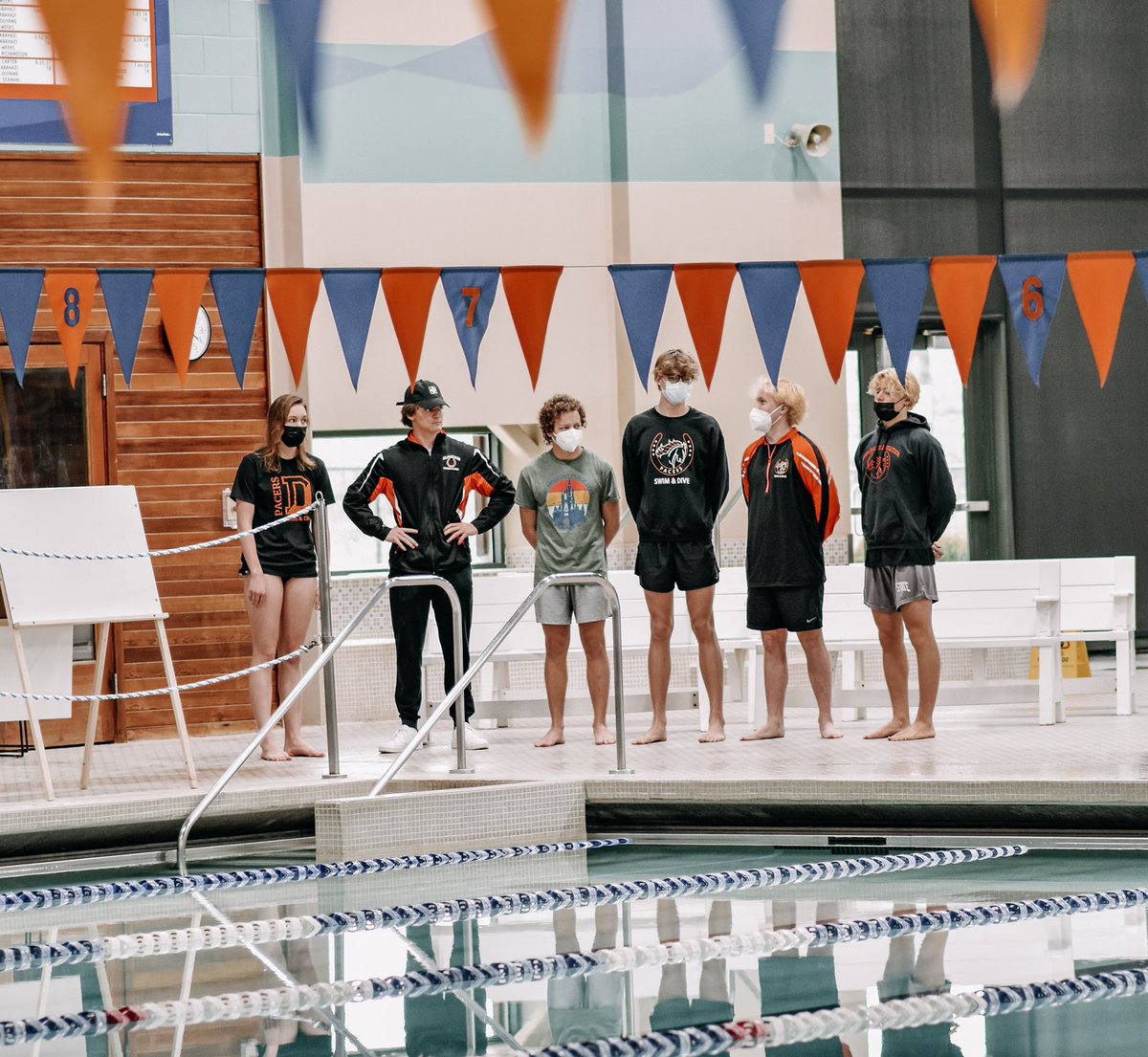 2022 Senior swimmers and divers posing for a picture before parent night festivities at the Delaware YMCA vs Marysville. Pacer Nation! 🐎