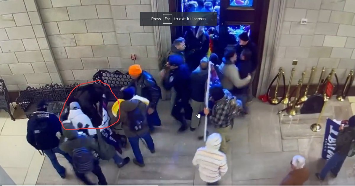 NormieConcerned's tweet photo. @DianthaSol @creek_twit @erica1933 @MThymol @FBIWFO Also, it's hard to tell because there are other people blocking the view, but is #SmokyInsider trying to help the cop back up, or is he trying to take something off of him?  His arm seems to move back and forth like he's feeling for something. https://t.co/QHe8qG3oXp
