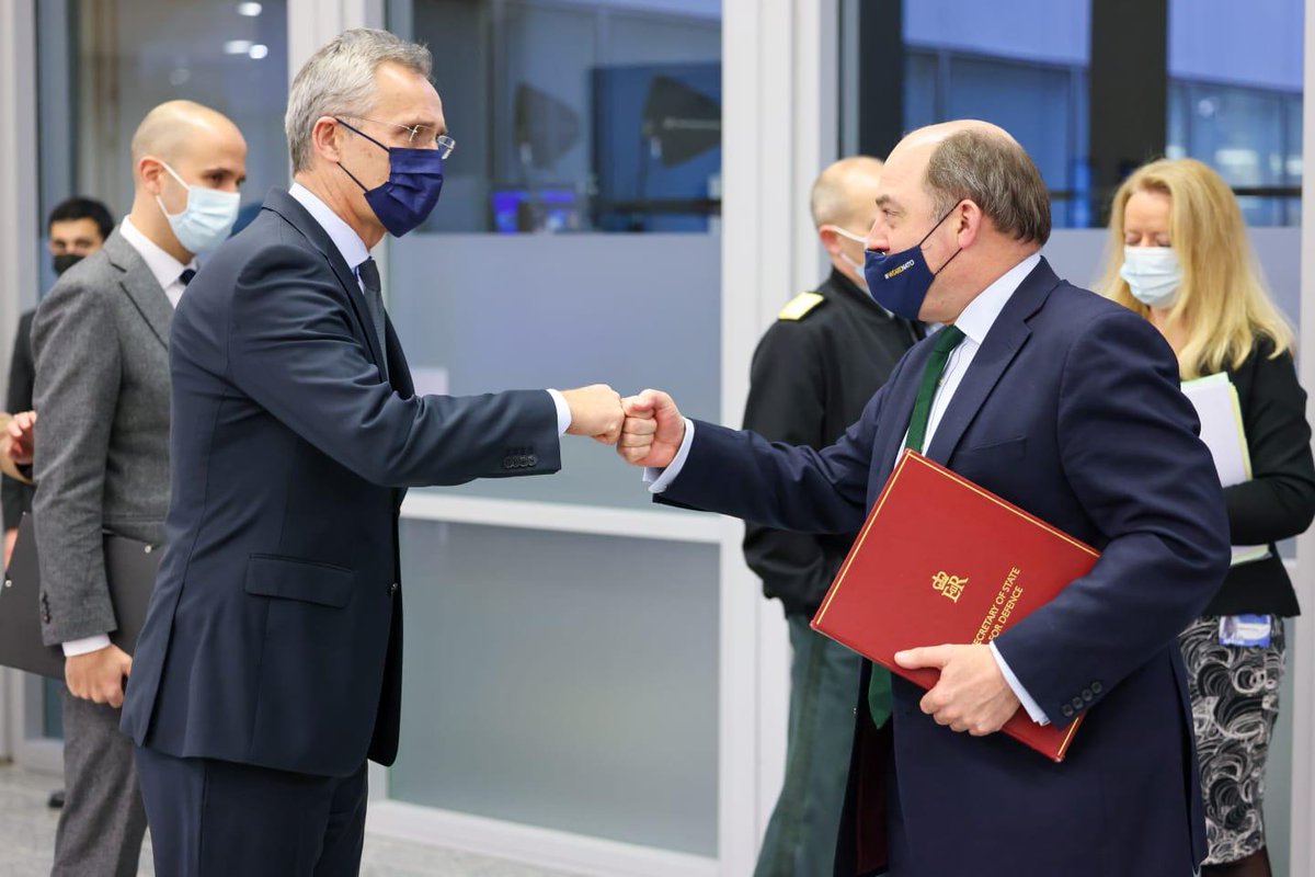 Defence Secretary Ben Wallace shakes hands with NATO's Jens Stoltenberg