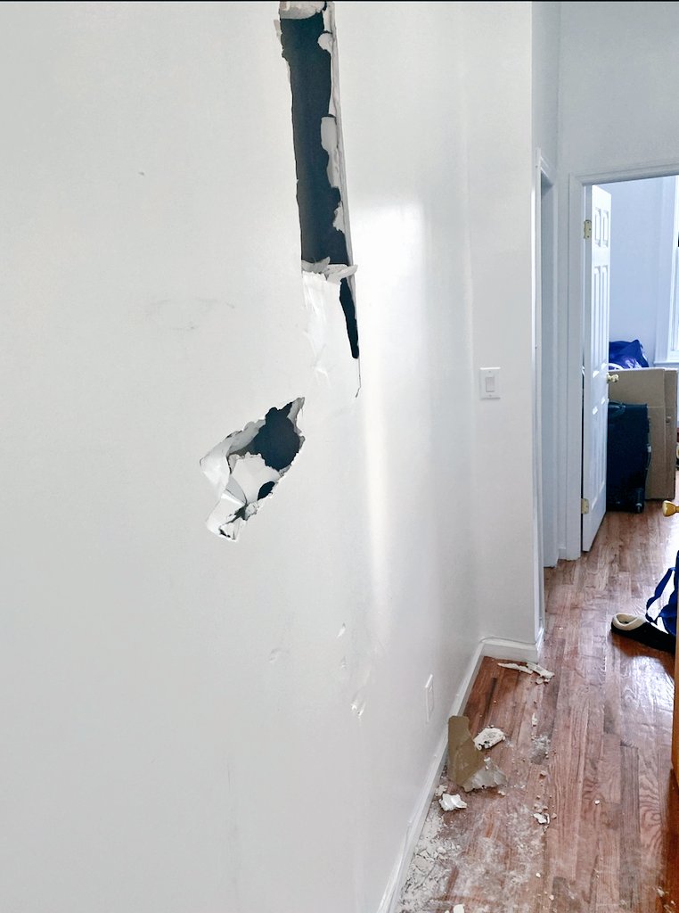 khriscrossing's tweet photo. So, while we wait on the wall repairs to happen, stuck up some posters so we're not sad looking at it lmao. https://t.co/xPaDLsrTPy
