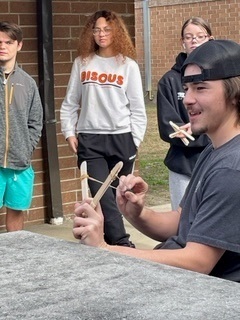 BryanCountyMHS's tweet photo. While studying the characteristics of quadratic functions, Mrs. Bennett’s College Ready Math class built catapults to shoot gummi bears to model the path of a parabola. ❤️🤍🖤#DeliciousLearning #GoRedskins #BeBC https://t.co/IKEPS0ZCbz