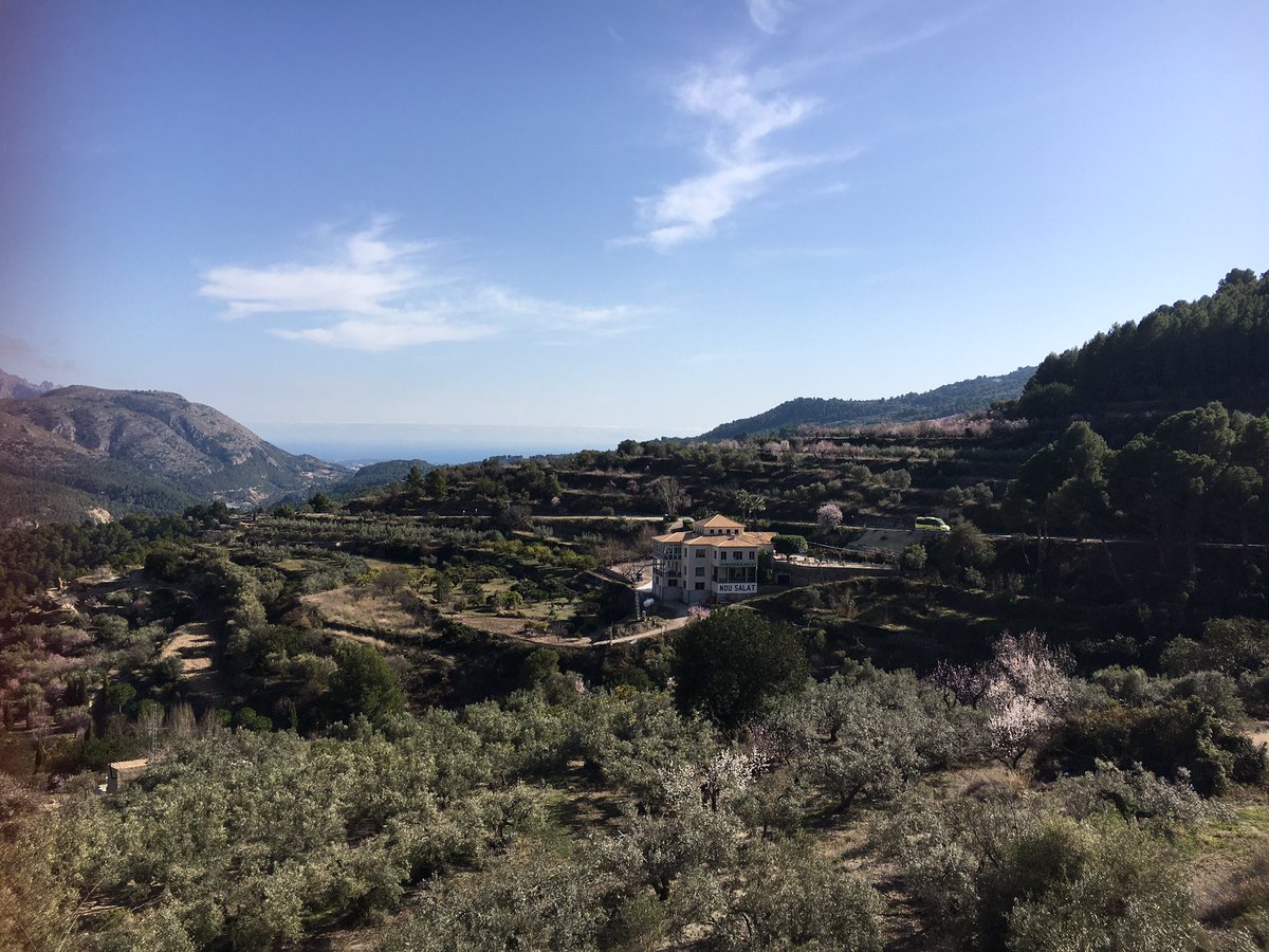 helengoth's tweet photo. Always look over your shoulder when #cycling up mountains to take in the scenery, or even better stop at a cafe with this view! A @TotesWonderfuel #Amazeball with an amazeview! #Guadalest https://t.co/5buf1bTlvK