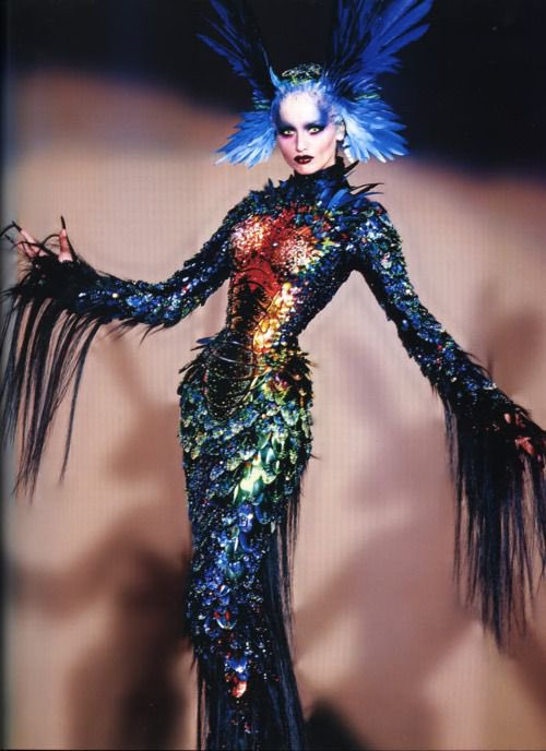 Thierry Mugler, one of the most iconic and expensive dresses in haute couture fashion history the Chimre dress. With colourful pearls, feathers, scales, real hair& and a gold corset. Thierry Mugler, one of the most iconic and expensive dresses in haute couture fashion history the Chimre dress. With colourful pearls, feathers, scales, real hair& and a gold corset.