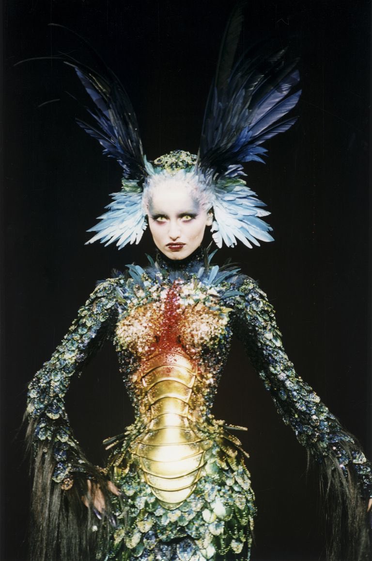 Thierry Mugler, one of the most iconic and expensive dresses in haute couture fashion history the Chimre dress. With colourful pearls, feathers, scales, real hair& and a gold corset. Thierry Mugler, one of the most iconic and expensive dresses in haute couture fashion history the Chimre dress. With colourful pearls, feathers, scales, real hair& and a gold corset.