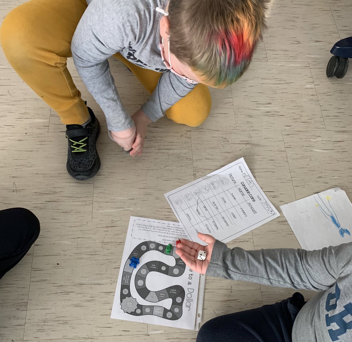 We are having fun identifying and comparing the values of Canadian coins! 💰