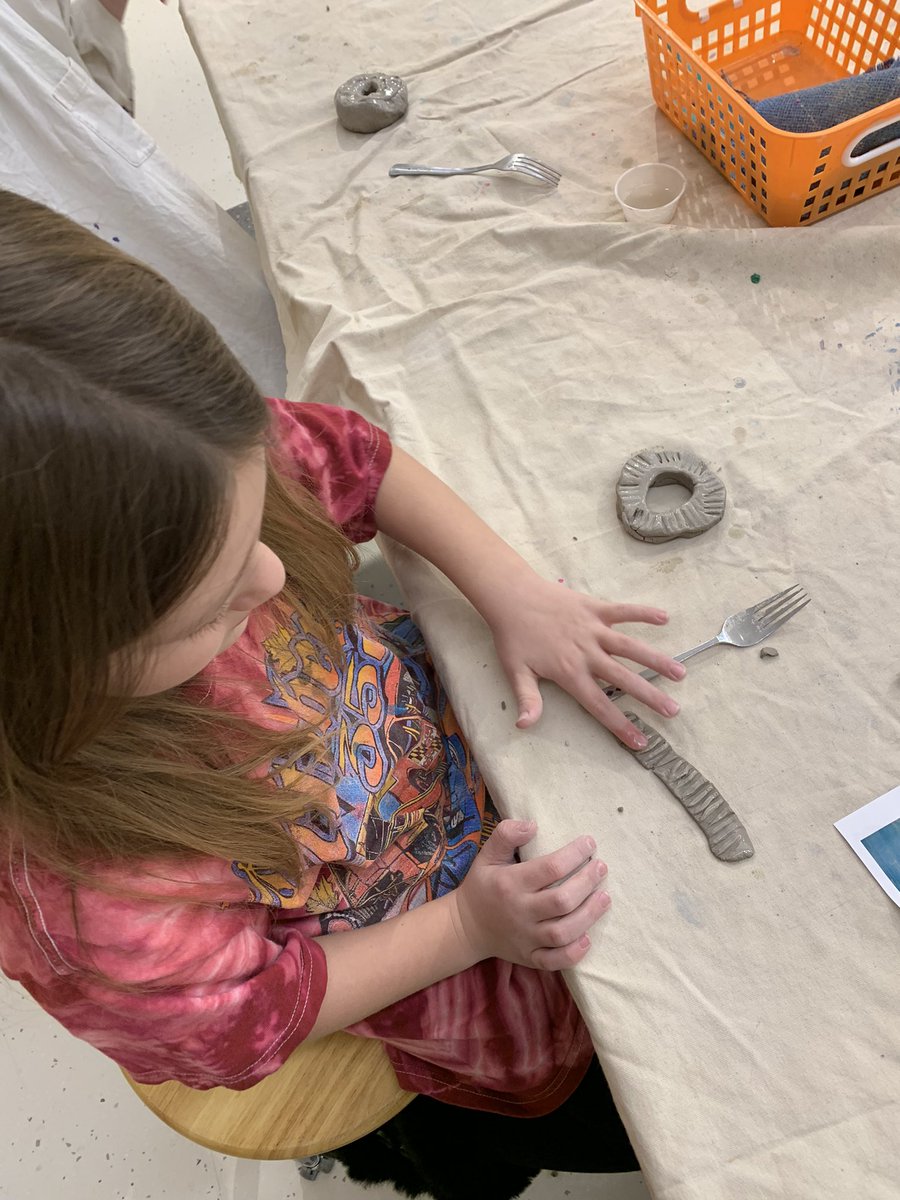 kthomas_artroom's tweet photo. Second grade learned about food sculpture artist, Peter Anton, and then created their own donuts out of clay. They learned how to use some clay techniques in their design: pinch pot, coil, score &amp; slip. Can’t wait to see them painted! @LehighElemNASD https://t.co/X37Wn0sLun