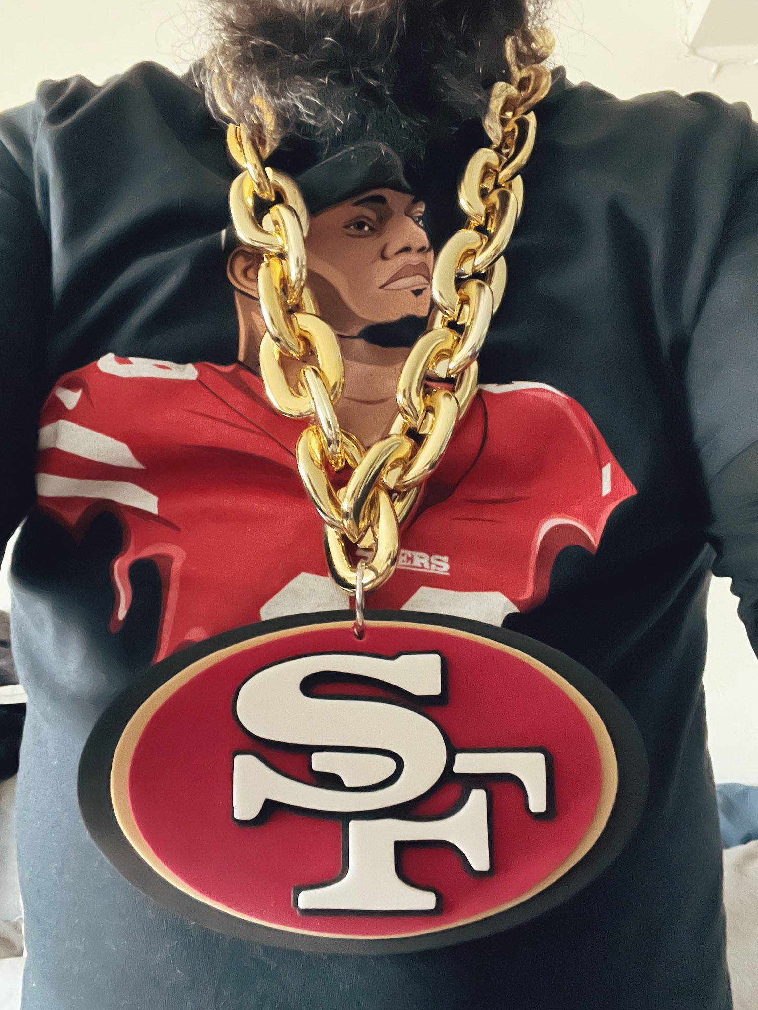 FOX Sports reporter Jen Hale works from the sideline, while displaying the  chain necklace purchased by San Francisco 49ers defensive back Jason  Verrett as a symbol to highlight a player who made