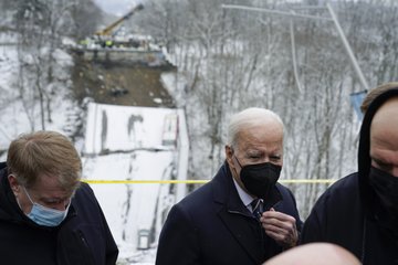 President Joe Biden walks away from the collapsed Forbes Avenue Bridge over Fern Hollow Creek in Frick Park