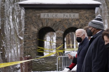 President Joe Biden surveys the damage at the collapsed Forbes Avenue Bridge over Fern Hollow Creek in Frick Park