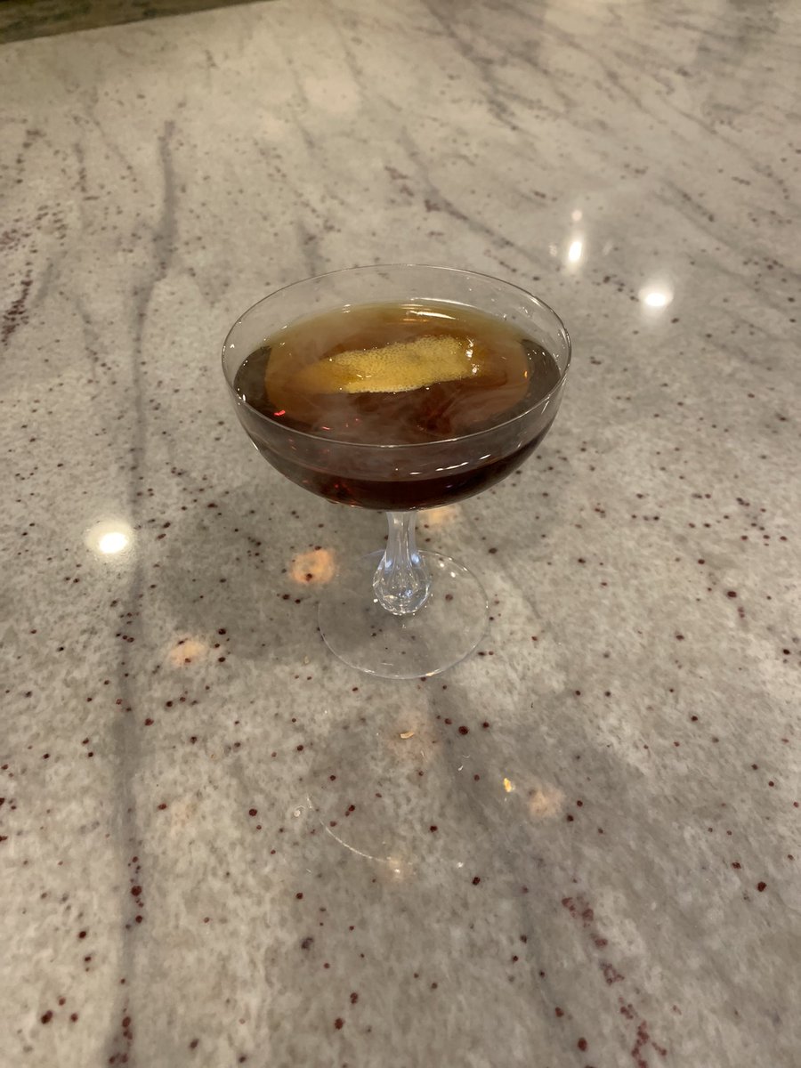 MacMerritt's tweet photo. Double black Manhattan: 
2 parts Laphroaig 
1 part Averna Amaro 
Bitters, lemon peel, and smoke https://t.co/VVEueuRWiD