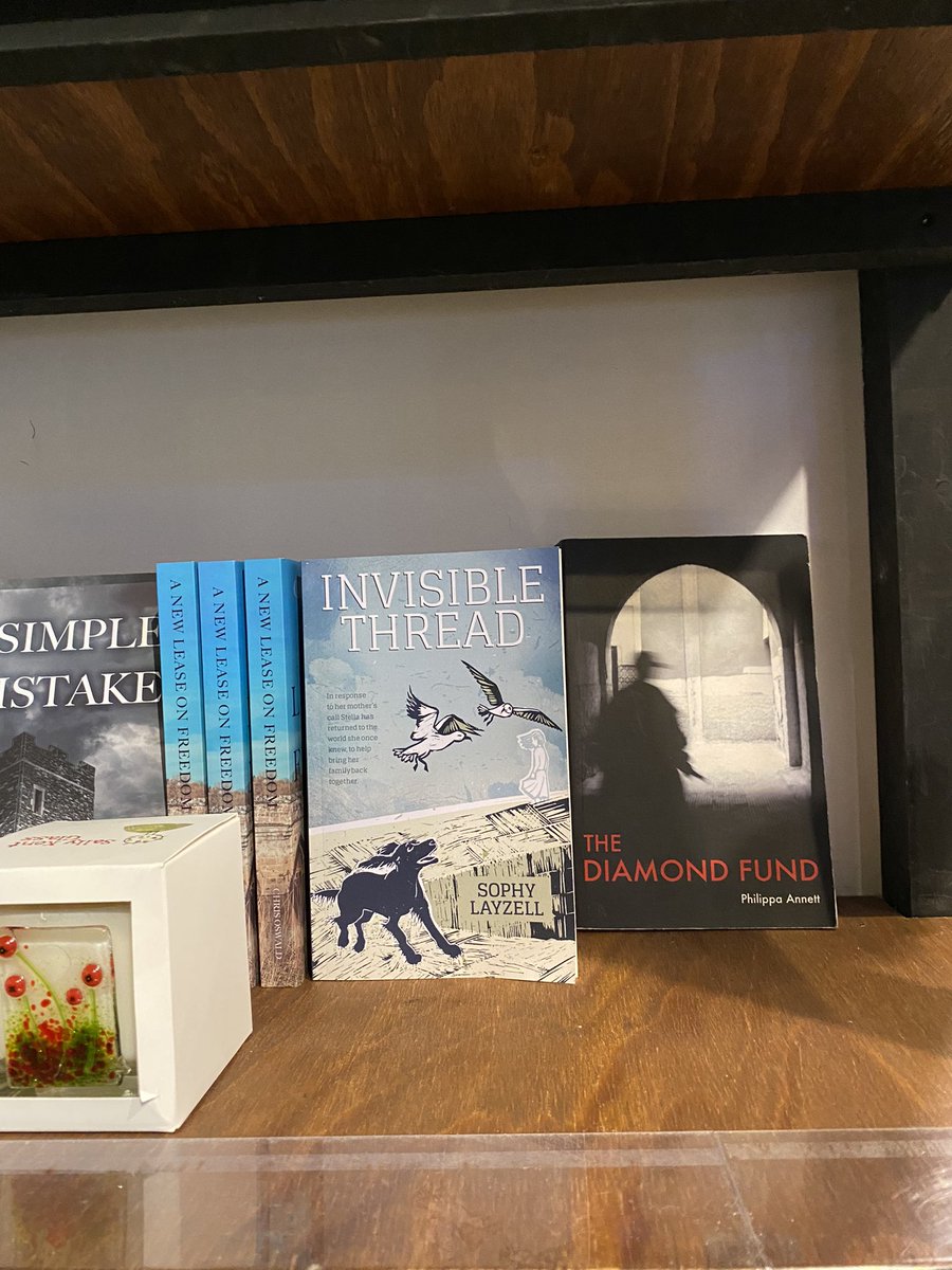Maddsophy's tweet image. A lovely selection of books by local authors at the Trading Post, Lopen, Somerset including mine 💕 #invisiblethread @Trading_Post_TP