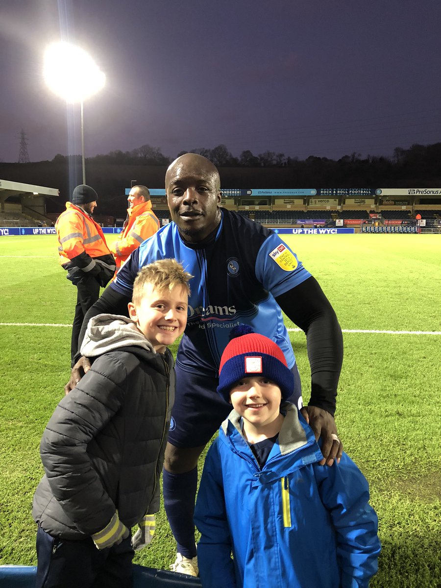 RobBullivant's tweet photo. What a top guy @daRealAkinfenwa who made these two’s day, considering the abhorrent abuse he was subjected to from away fans and losing the game to still come over at the end to do photos long after full time..making sure he saw everyone that waited for him 👏🏼👏🏼@wwfcofficial https://t.co/V9Y6TDOw1b