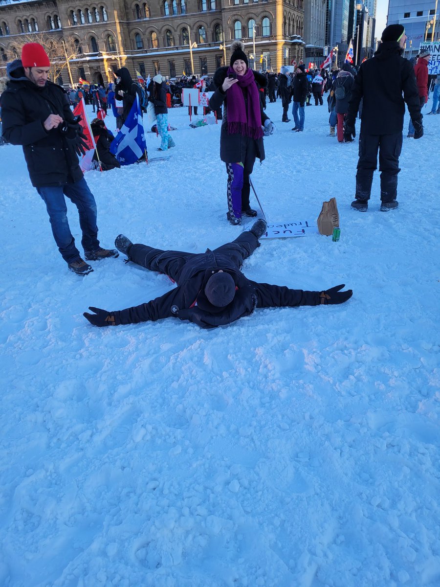 TheRealKeean's tweet photo. The dangerous extremists are now making snow angels on Parliament hill. #CanadianInsurrection https://t.co/BYdIxMeJmF