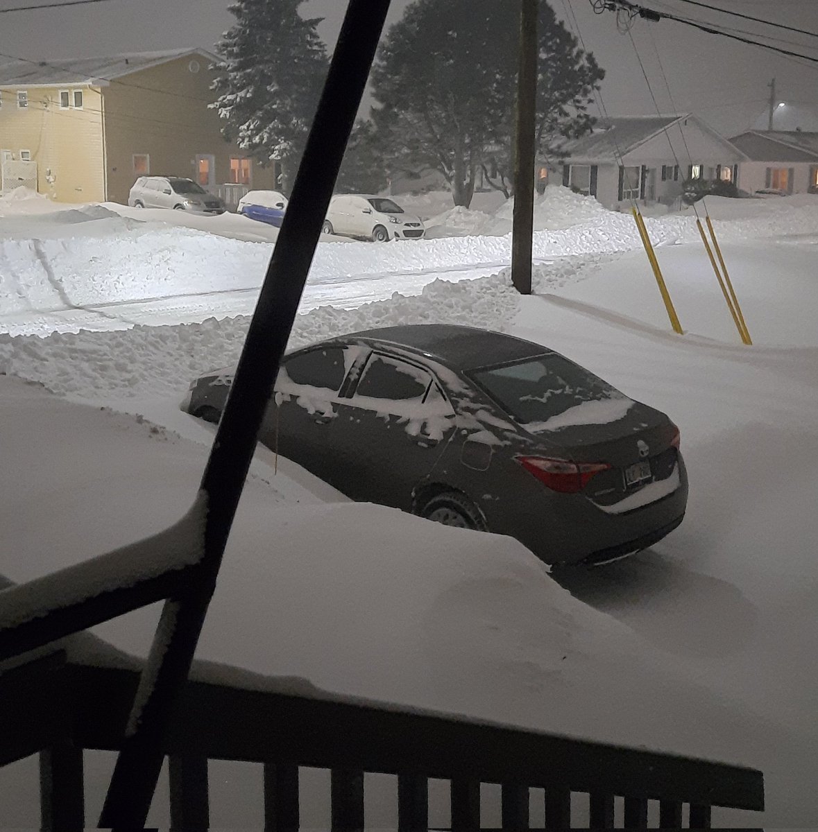 pertjab's tweet photo. #NBStorm snow bank at end of driveway is now higher than the car and we're only at the halfway point of snow accumulation. https://t.co/wInPjfjTiT