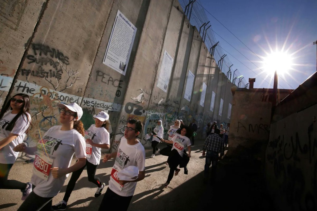 AmosTrust's tweet photo. Run The Wall 2022 – Registration is now open for 11–12 March when we will be joining with 100’s of runners from all around the world to run 750km — the length of the Israeli Separation Wall in Palestine. https://t.co/amw64xl8ce #WeDoHope #PalestineJustice @RightToMovement https://t.co/F5aTrO7afK