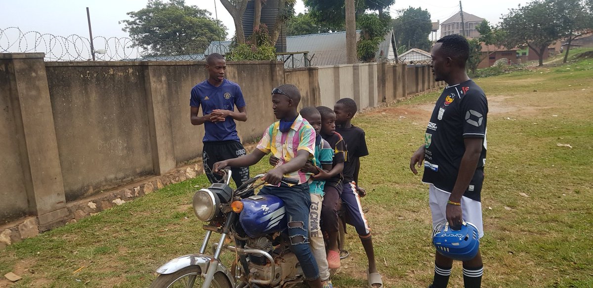 GaaUganda's tweet photo. Other kids arrive on motorcycles from neighbouring villages to attend the weekend training sessions lf Hurling and Gaelic Football in Uganda. @IrlEmbUganda https://t.co/f9wgqnhr7I