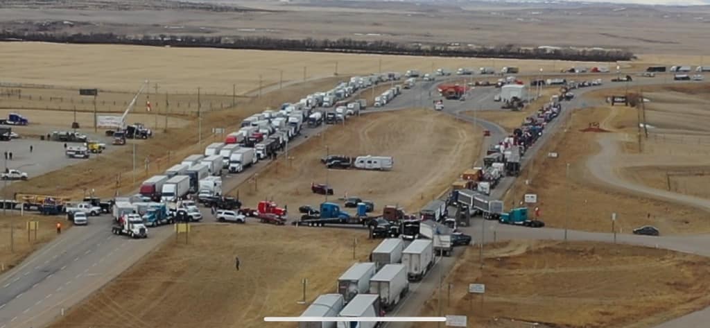 National news hasn't touched on the large protest that has blocked the US/Canada border down in Coutts Alberta for nearly 24 hours how. 

The Truckers for Freedom movement is active well beyond Ottawa
