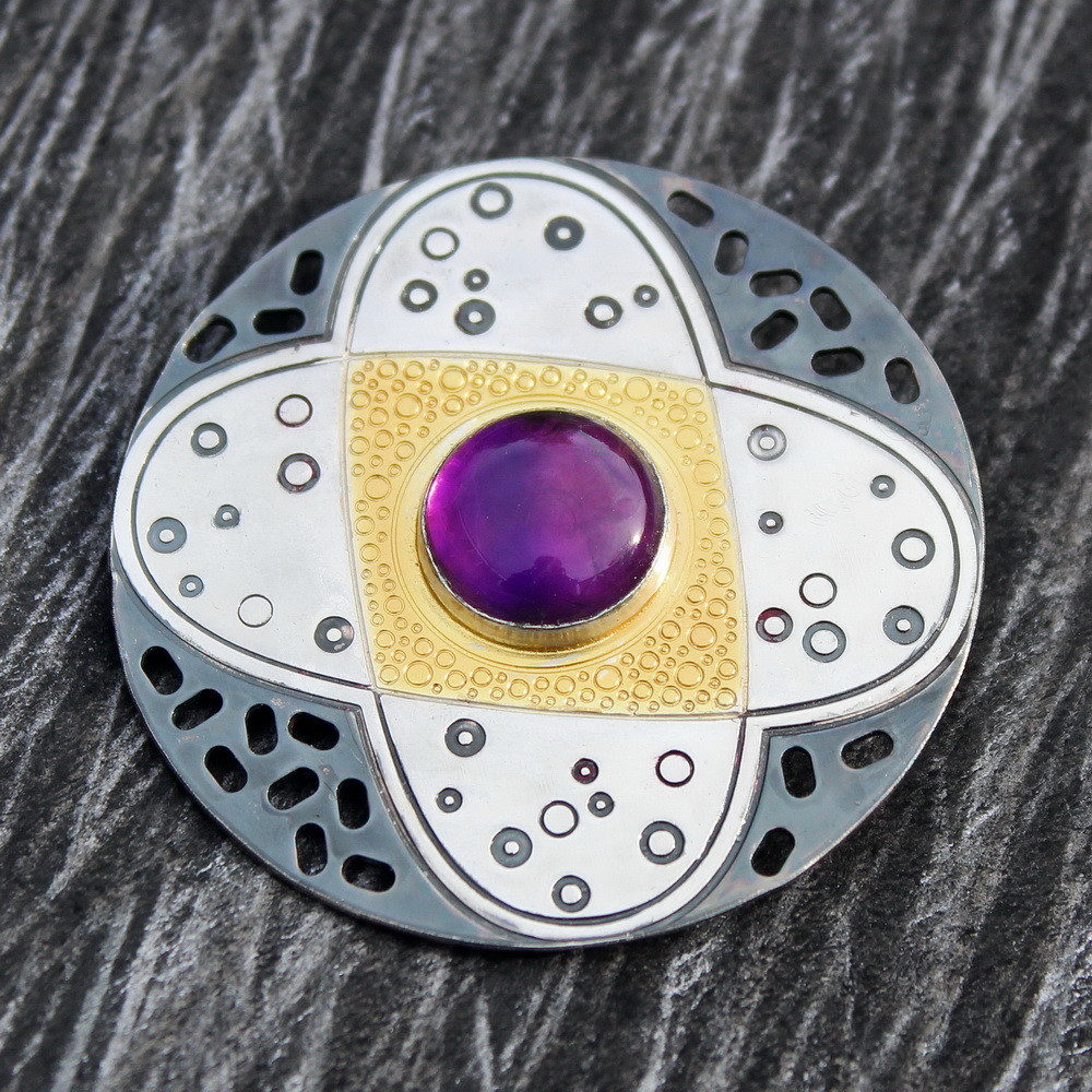 Amethyst - February's birthstone.
This large 44mm sterling silver and gold brooch features a lovely 12mm Indian Amethyst stone.

#Amethyst #amethyststone #Brooch #handmadejewellery #handmade #gemstone #contemporaryjewellery #purple #sterlingsilver #handmadejewelry #jewellery #art
