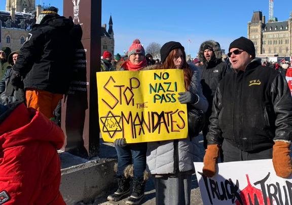 CanadianFSWC's tweet photo. We are disturbed by the appearance of Holocaust symbols at the rally in Ottawa yesterday protesting government responses to the COVID-19 pandemic. These symbols of hate and genocide have no place in Ottawa or anywhere in Canada. 

Read our statement here: https://t.co/Zi23Z32m6K https://t.co/eZOvuDuFvt
