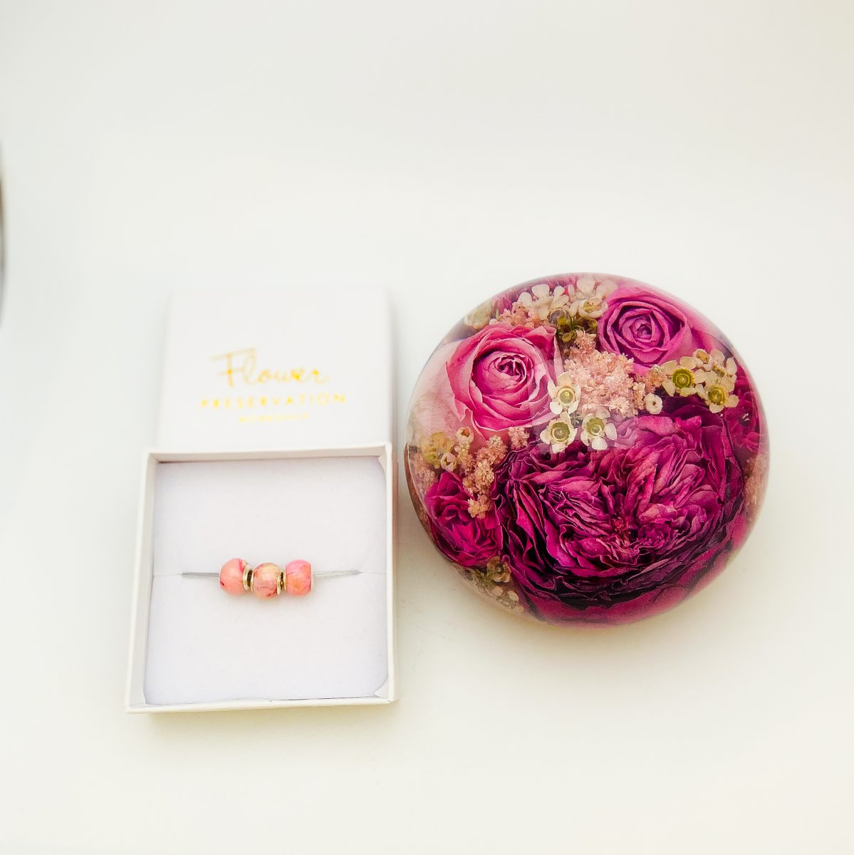 preservedintime's tweet photo. Lots of pink going on here .... preserved and enclosed within our luxury flower paperweight designs https://t.co/RjKgL5Bogy