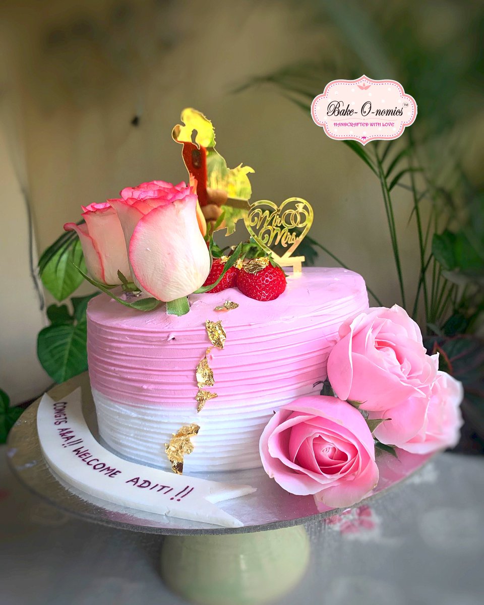 Bakeonomics's tweet photo. The pandemic is responsible for many of us to miss family affairs of our very dear and close ones. 

A cake to Congratulate the newly weds and to welcome the bride home

Inside: Chocolate cake,  whipped cream and strawberries

Outside: Whipped cream, fresh roses and strawberries https://t.co/oeA39SmqVG