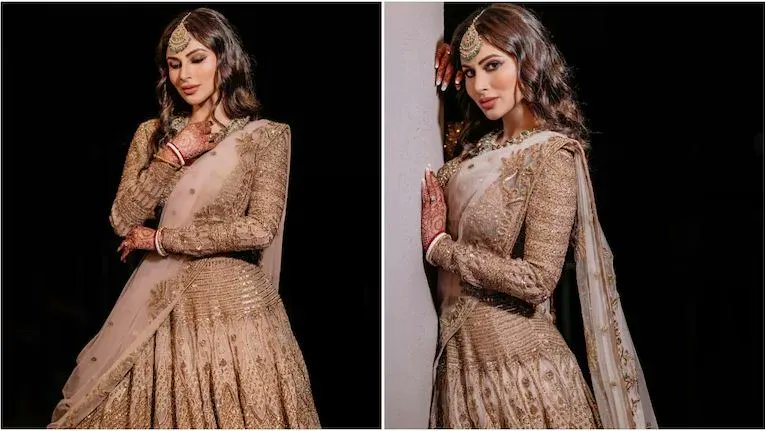 #MouniRoy dazzles in glam golden lehenga for #sangeetnight. Stunning pictures bit.ly/2W2IVI8 #WeRIndia