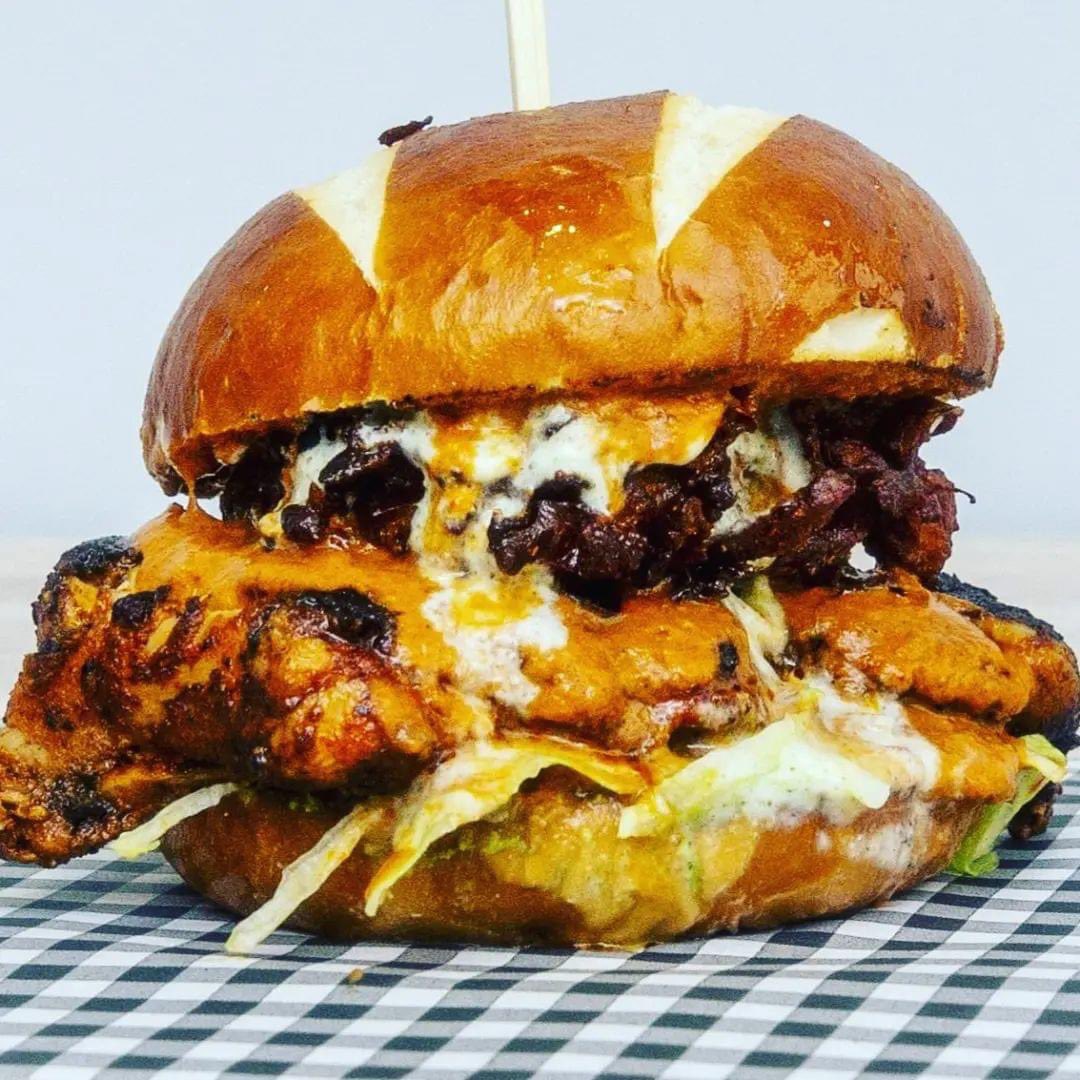 🍔 The Butter Chicken Burger 🍔 Bringing this #deliciousness back! You'll be able to grab one of these badboys as of tomorrow only from @ContactMcr’s @contactbarkitch 😋 Available for sit in or takeaway from 3pm