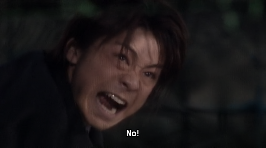 Kiba is still rejecting Takumi's statement and is unable to pass through. The net could easily be stepped around if he were to become aware of his surroundings but he's still stuck in the belief he's been fed about Orphnochs and humans being unable to co-exist 