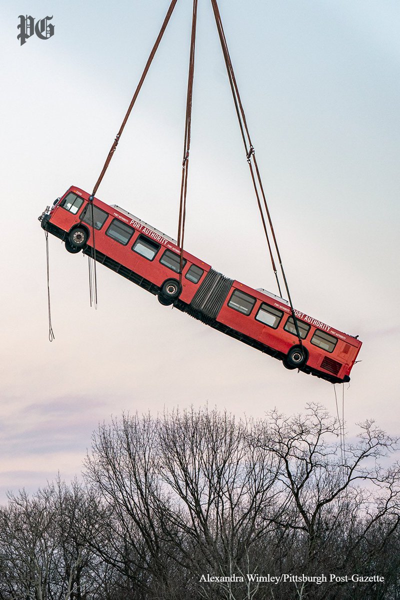 PittsburghPG's tweet image. The trapped Port Authority bus was hoisted out of the wreckage from Friday morning’s Forbes Avenue bridge collapse by a massive crane, capping the daylight hours that saw other vehicles also lifted out of the rubble.

📸: @alexandrawimley