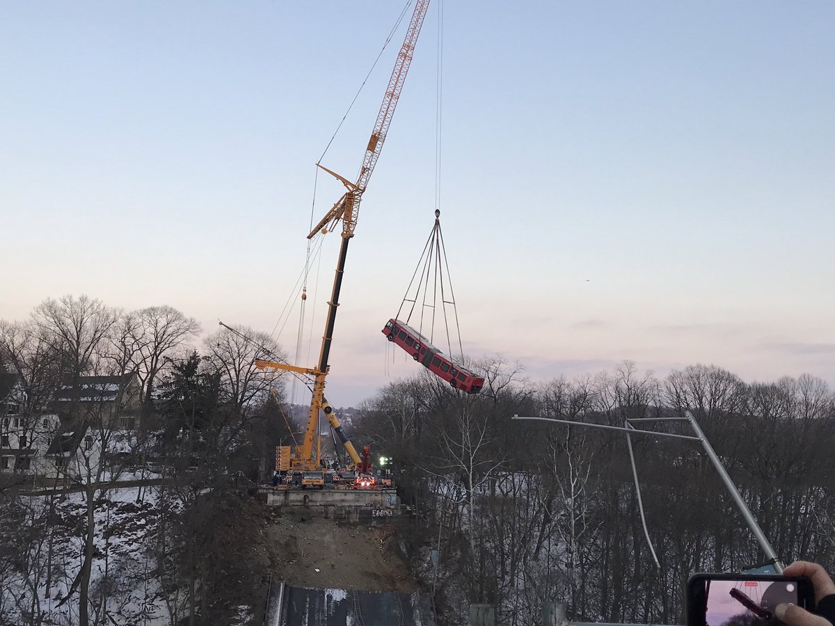RyanDeto's tweet image. The Port Authority bus now lifted high above the Pittsburgh collapsed bridge. Over the tree line. @TribLIVE