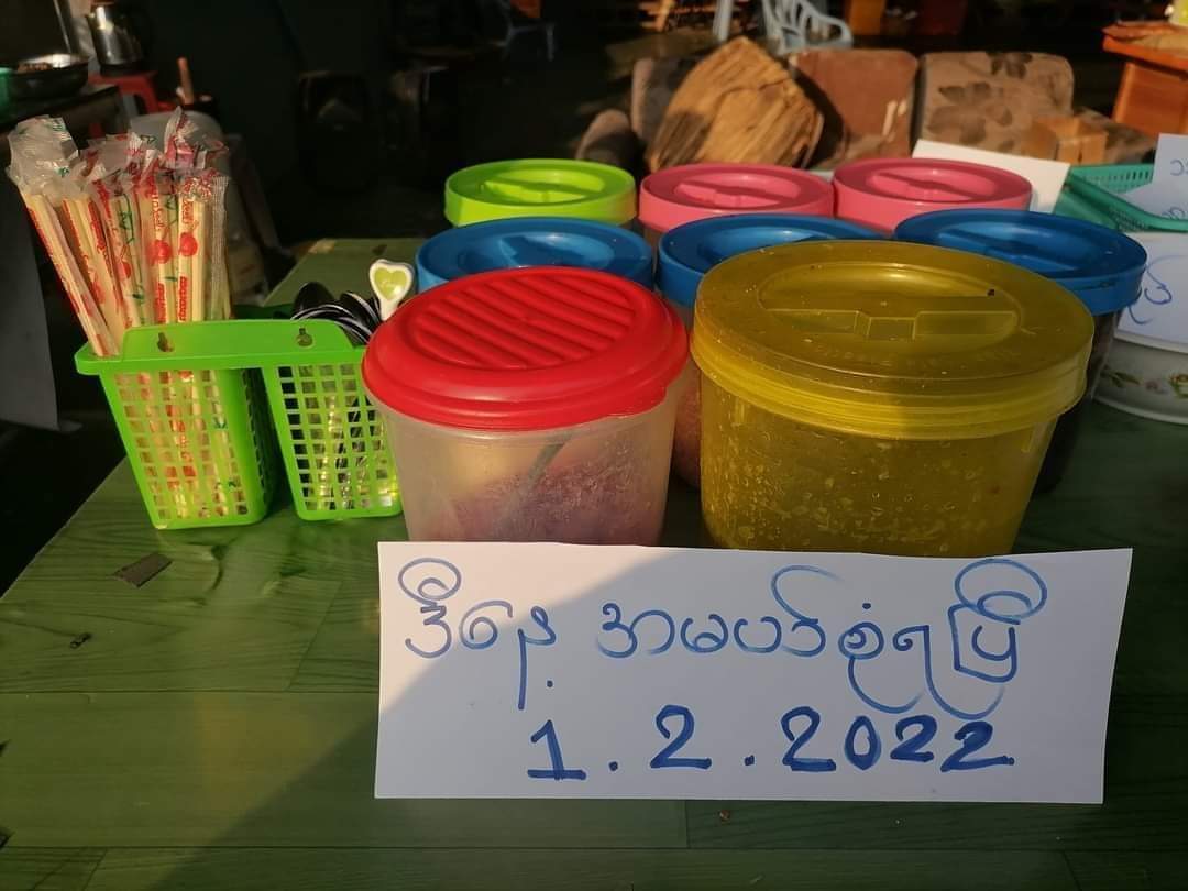 SaveMM99's tweet photo. When Junta's forcefully forcing shop owners to open the shops to stop #SilentStrike,this is how vendors open their shops only placing plates &amp; names of items in cards without placing items.From the rich to the poor,all types of civilians are revolting against Junta. #2022Feb1Coup https://t.co/q5RrW4h5kW