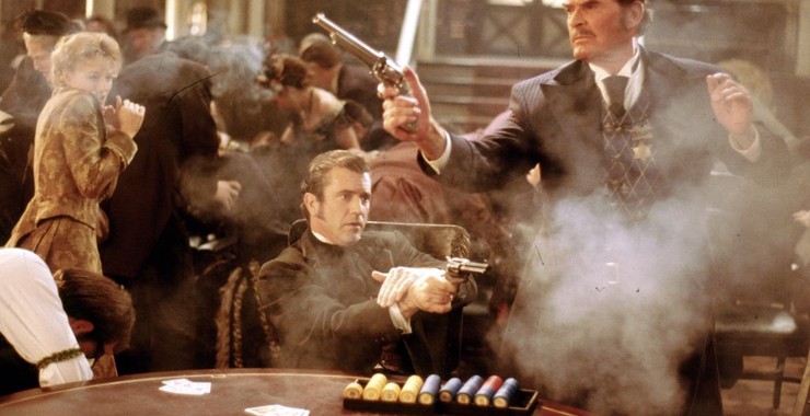 Maverick (1994) is a great western comedy starring Mel Gibson as a fast-talking and cowardly gambler trying to scrape together enough money to enter a once-in-a-lifetime poker tournament. Made by the Lethal Weapon crew.