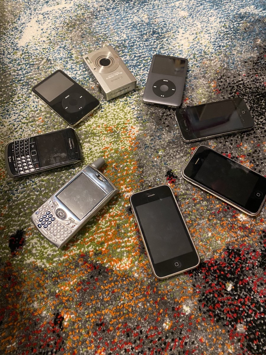 ErikaDSears's tweet photo. Cleaning out the basement and kids want to play with what they call “antiques” 😆 #blackberry #palmtreo #iphone2 https://t.co/pmR5b2r25S