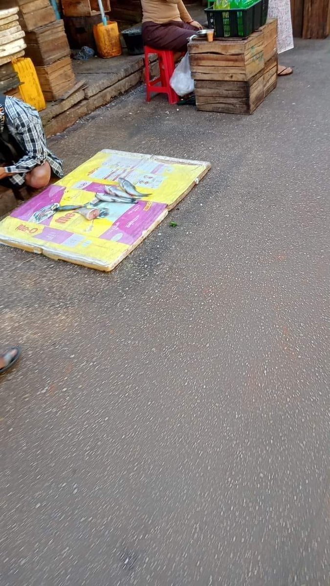 TheChindwin's tweet photo. In efforts to disrupt the people’s Silent Strike, Myanmar military junta has forced few individuals to sell in the street market with no buyers seen in the street. 
Photo – CJs https://t.co/tb0vqhKTzW