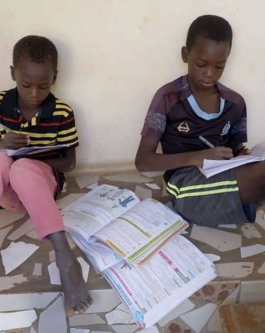 AlessioDevPool's tweet photo. ❤️New month, new donations! I'm happy to announce that the school fees support were received by Aliou from Senegal, for his 3 kids.
#DevPool just donated 93.37 €!
Here's Babakar and Fallau who are doing their homework. Stake with us! Ticker DEV
https://t.co/rtGBA6bGzN
#Cardano https://t.co/DT1di9b4xh