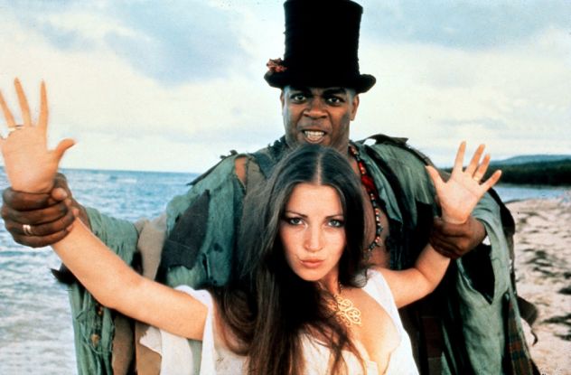 Jane Seymour (Solitaire) and Geoffrey Holder (Baron Samedi) striking a pose on the set of Live And Let Die #liveandletdie #jamesbond #janeseymour #geoffreyholder