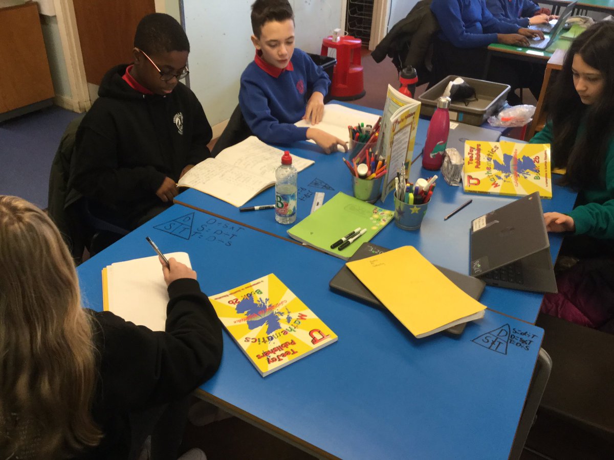 MrsReid_N's tweet photo. Using our desks to remind us of the distance, speed and time formula. #maths #triangleformula #distancespeedtime https://t.co/sXYLvFEksG