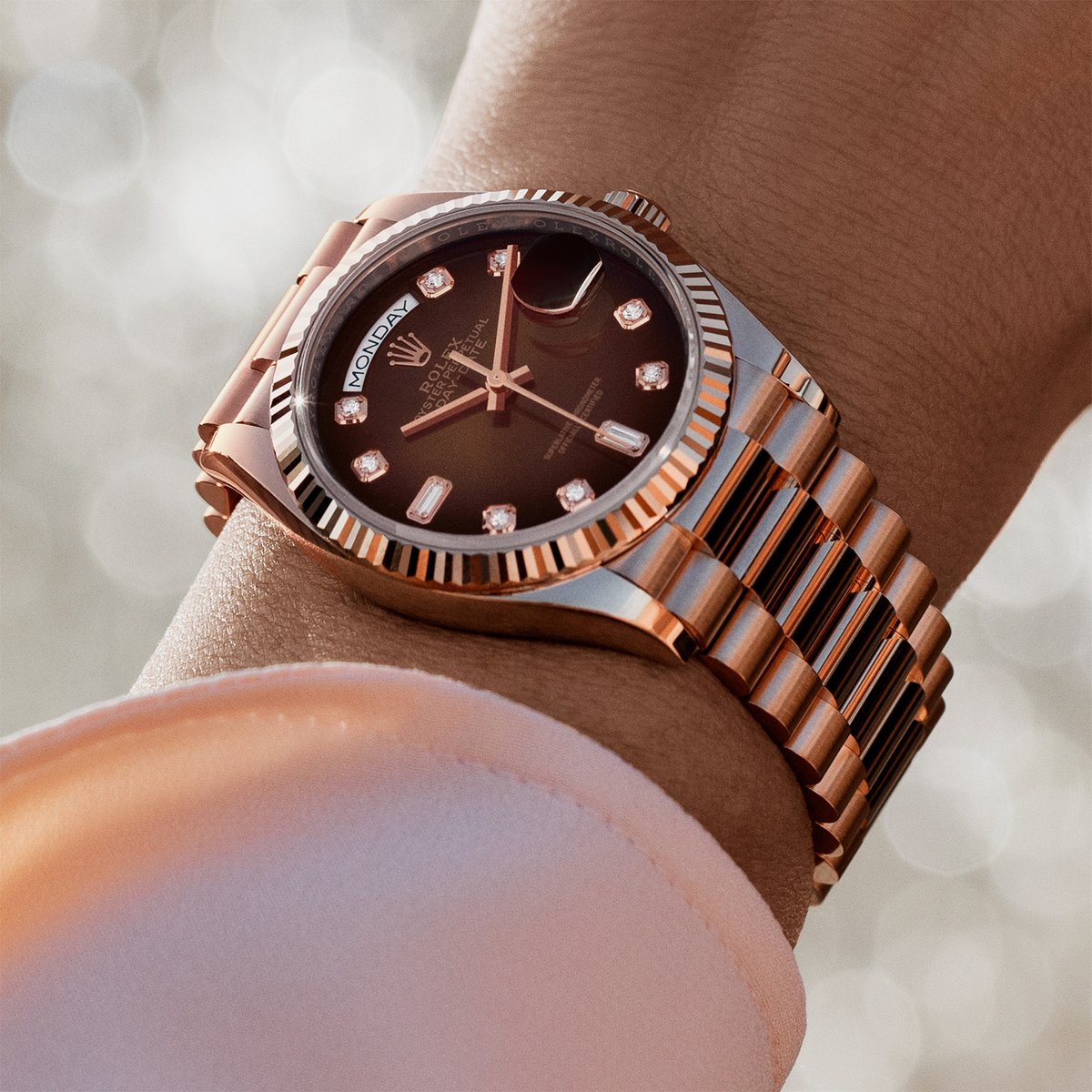 The ultimate watch of prestige. The Rolex Day-Date 36 in 18 ct Everose gold, 36 mm case, brown ombré dial set with diamonds, President bracelet. #Rolex #DayDate