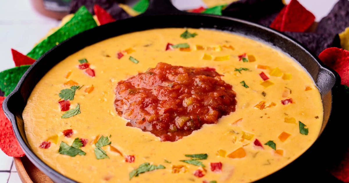 This Cast-Iron Smoked Queso Dip is a must! With a blend of delicious cheeses, <a href="/Fresh_Cravings/">Fresh Cravings</a> Salsa and smoky chorizo, this #queso dip is a winner at any #gameday party.