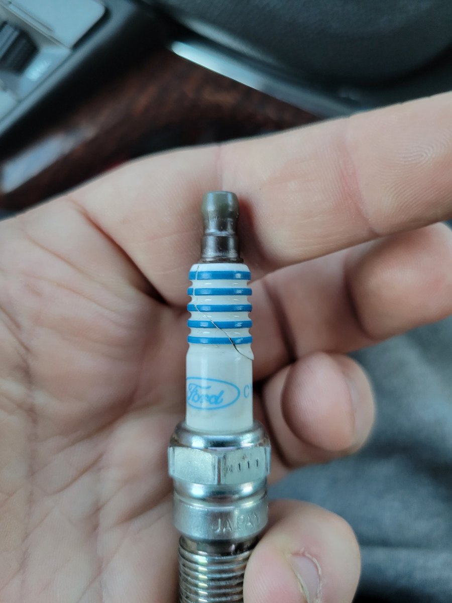 UNCLE_XAN's tweet photo. If you look to your right you'll see a cracked Ford sparkplug... That came from my Chevy Malibu... So like thats ok right? https://t.co/JTSebzxvu4