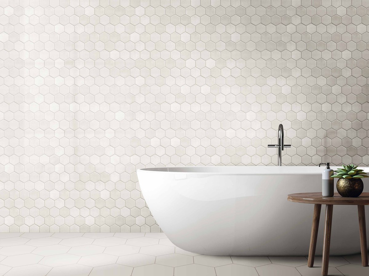 TileMountainUK's tweet photo. Hexagonal tiles are still a firm interiors favourite. Check out our Hexagon Lustre  Decor wall tiles &amp; larger format Apollo Hexagon White porcelain tiles below. You can even complete the look with a Newham  Freestanding Bath from @BathroomMUK 

#interiors #DIY #tiling https://t.co/7zspZt0F9N