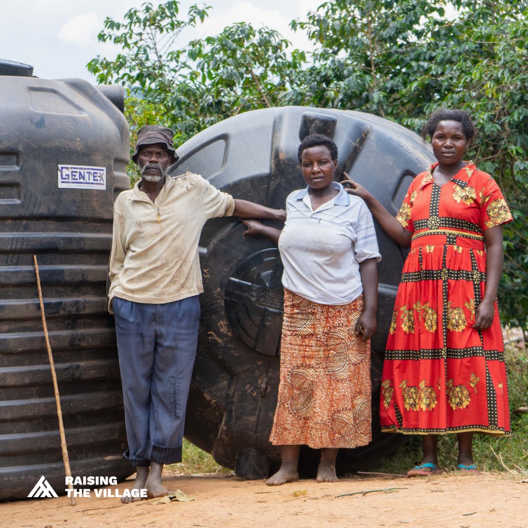 Community members in Ibarya Cluster with rainwater harvesting systems.