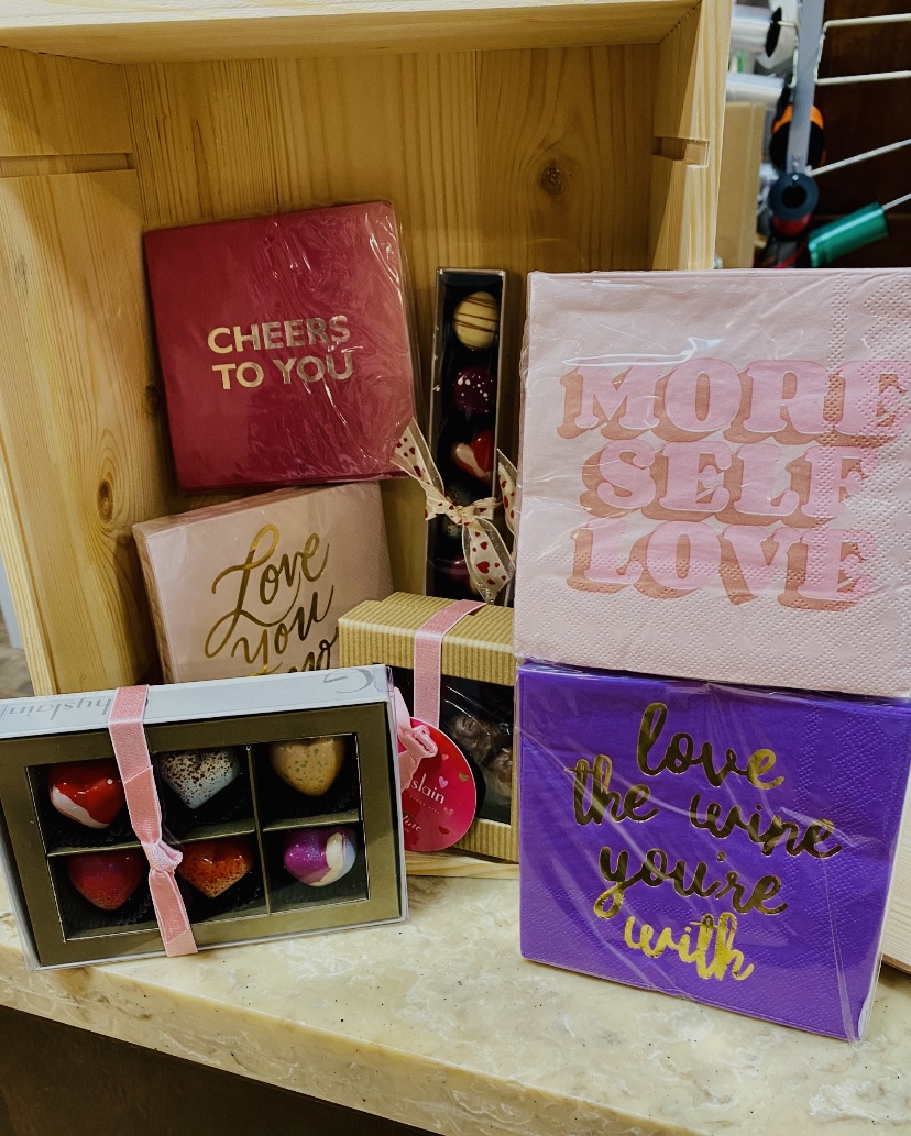 All you need is love and wine.  But a box of chocolates doesn't hurt!