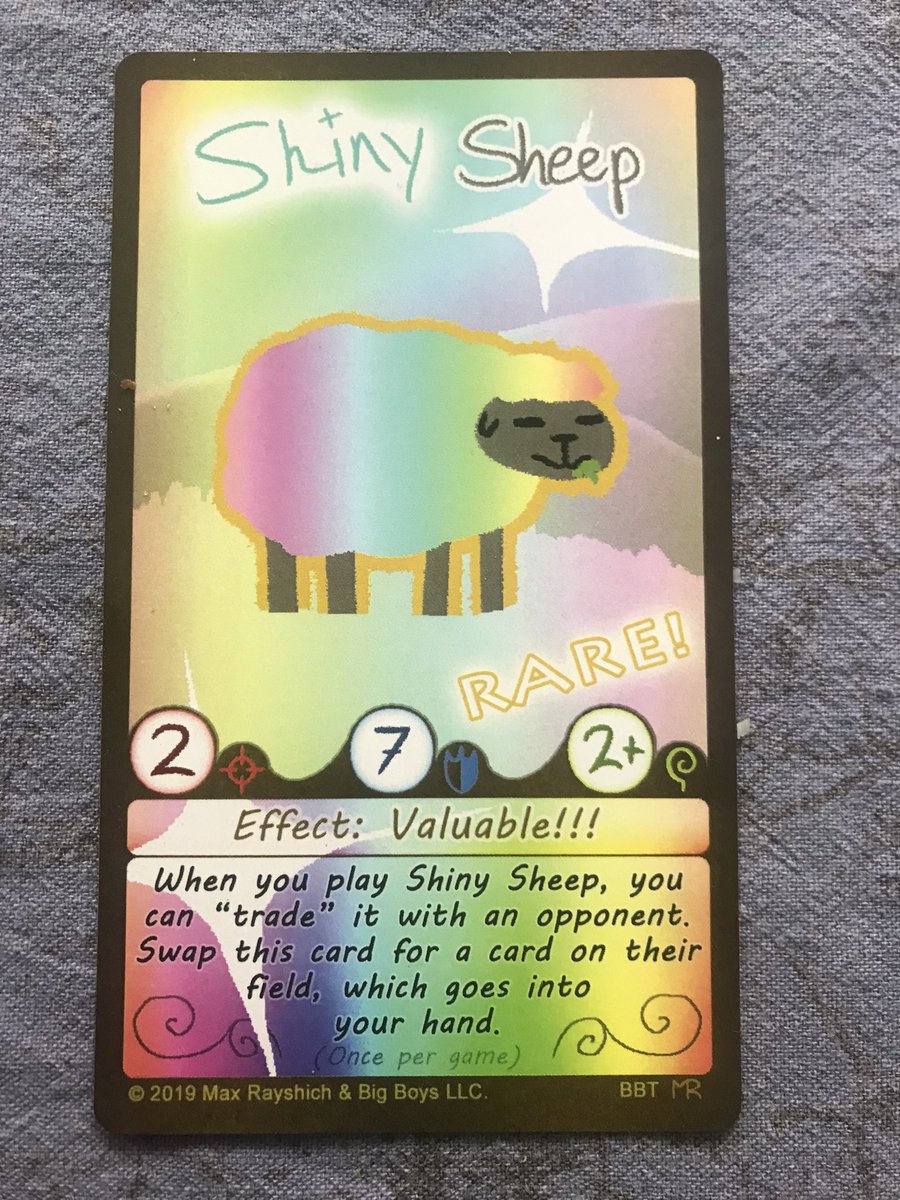 BigThrowdown's tweet photo. BBT classic edition vs new edition, featuring Shiny Sheep!✨

We thought the rainbow effect was fun, but it made things impossible to read and didn’t really sell the idea of this being a “rare” card. As always, drawn by @TheMaximumArt 
#boardgame #cardgames #tabletopgames https://t.co/XJH2MHvM6D
