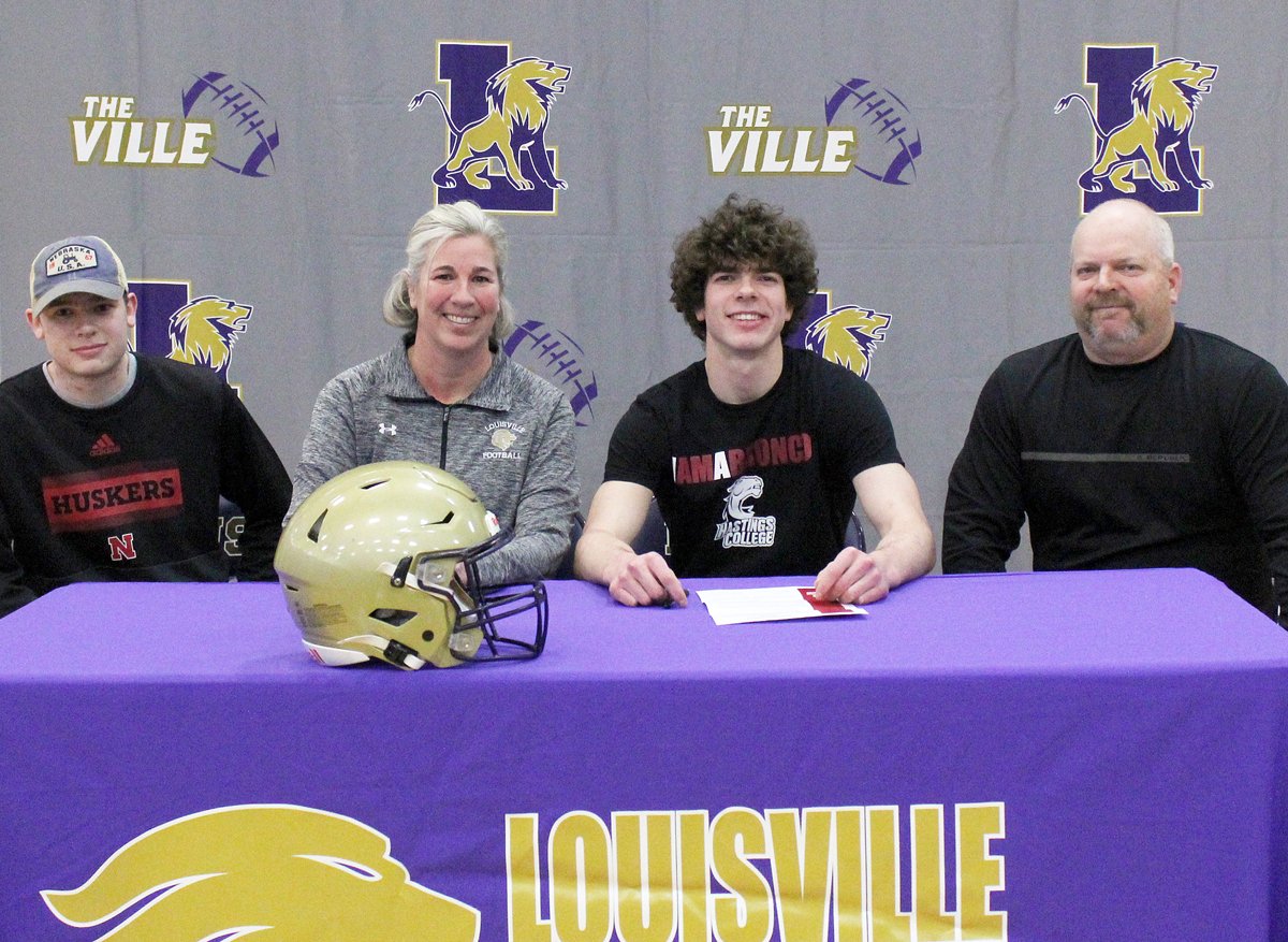 Louisville senior Sam Ahl signed a letter of intent today to play football at Hastings College.