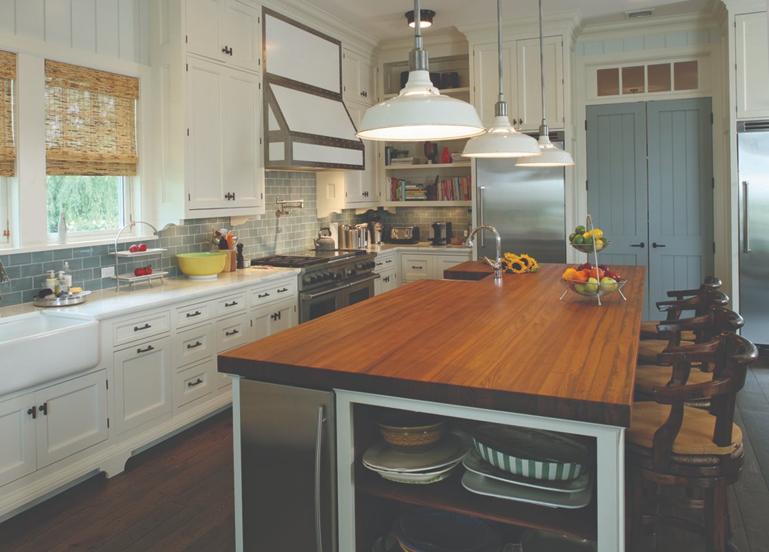 Teak edge grain island in a classic white kitchen.