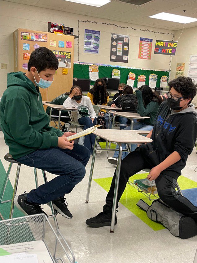 AlamoMiddle's tweet photo. Yesterday our Badgers took part in #WorldReadAloudDay! Mrs Deleon’s 7th grade RLA class takes time to read to one another. #badgersread https://t.co/BSlTLgu5d2