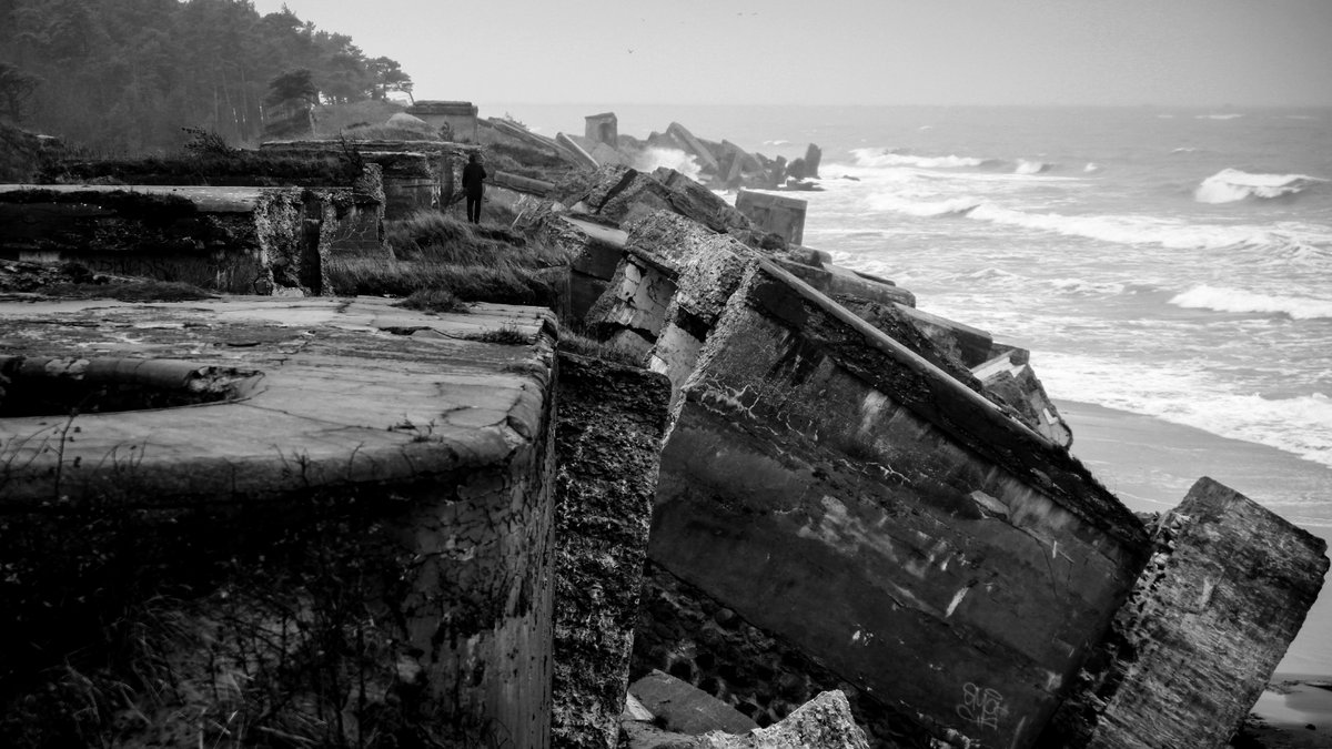A seawall falling into the sea due to erosion.
